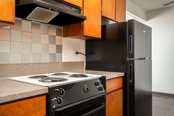 a kitchen with a stove and a refrigerator